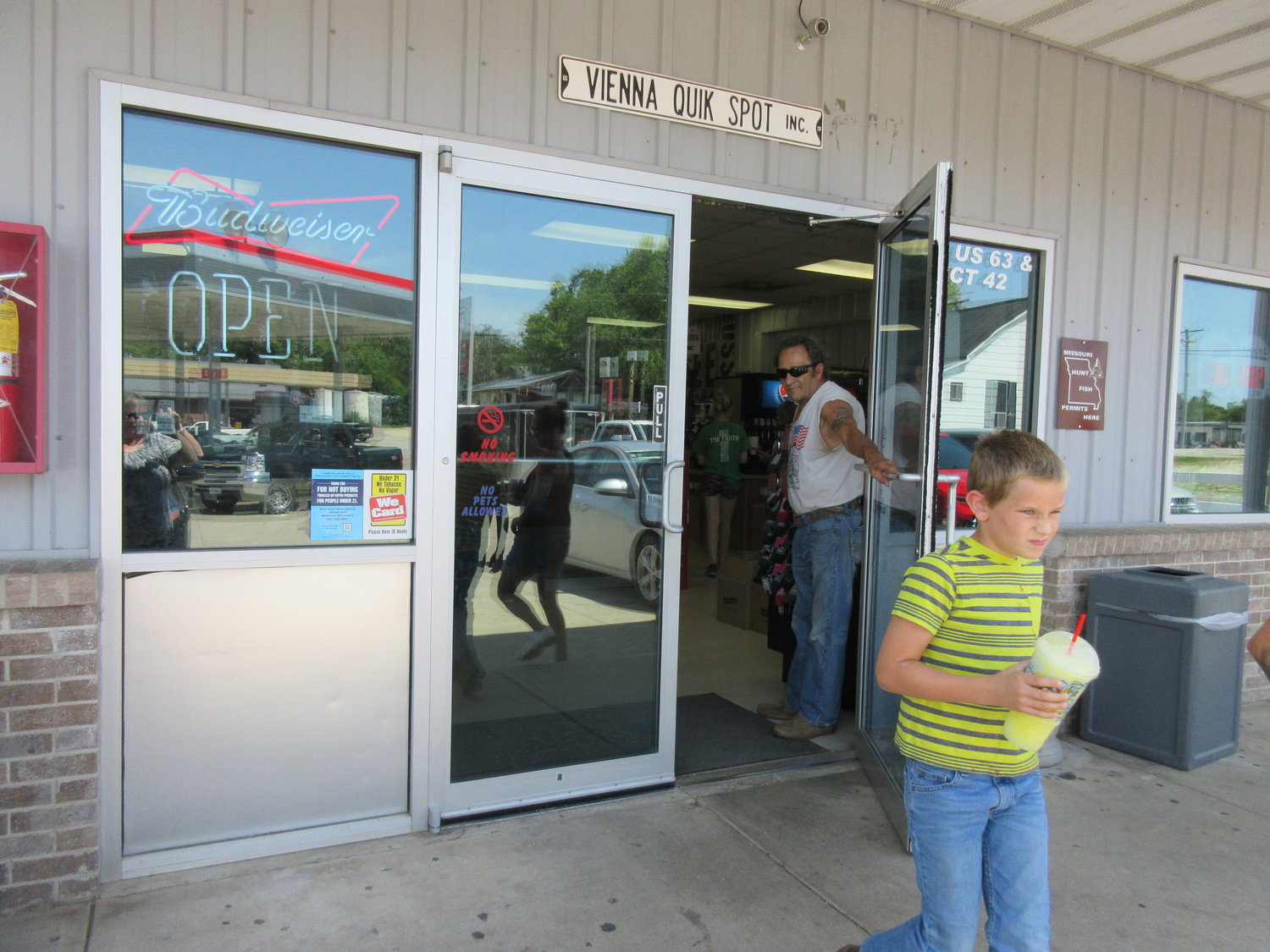 A Vienna Quik Spot customer has the door held for him and his family by a local Vienna man. The convenience store and gas station is a busy place in town.